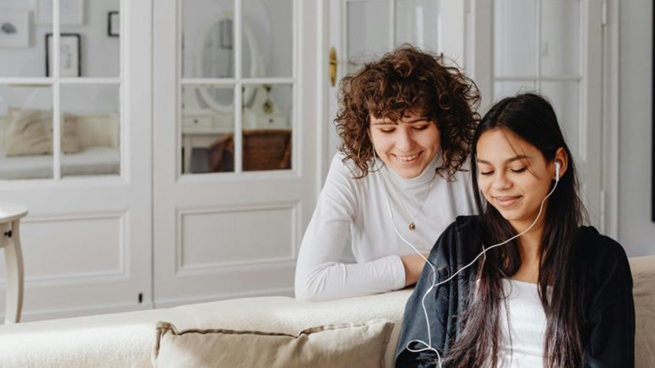 Teens looking at something together