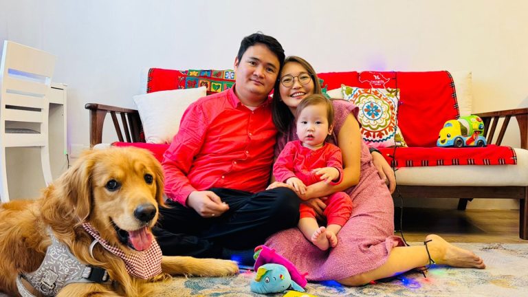 Odko and Urangoo with their baby and dog