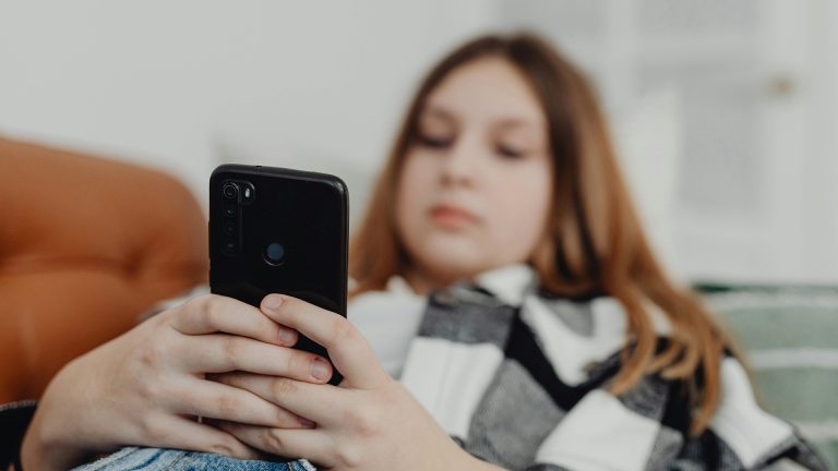 teen on her phone