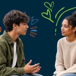 two teenagers talking with each other