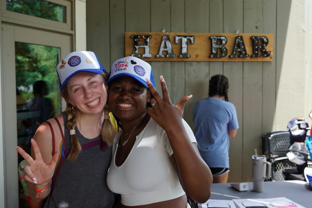 teen girls having fun at a hat bar at a young life camp