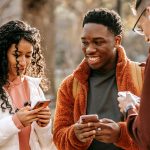 group of teens on their phones