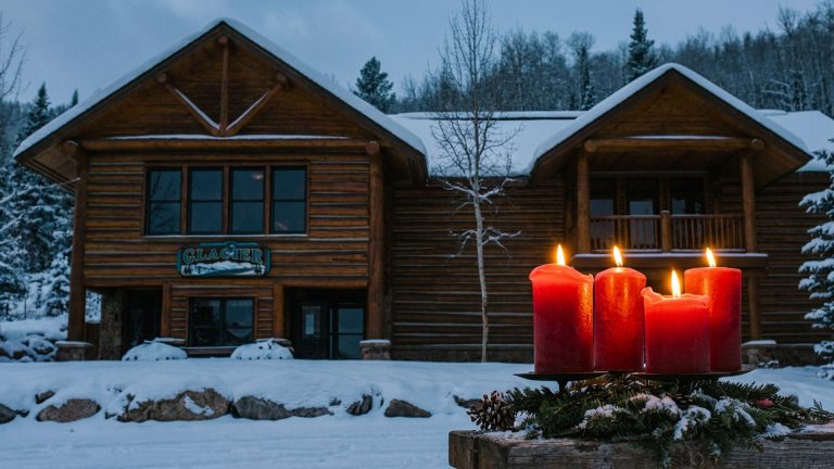 crooked creek young life camp with four advent candles in the foreground